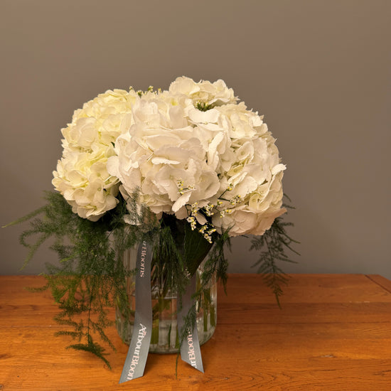 Pure White Hydrangea Vase — hand-tied white hydrangea bouquet and asparagus fern by Arbour Blooms, Dublin florist.