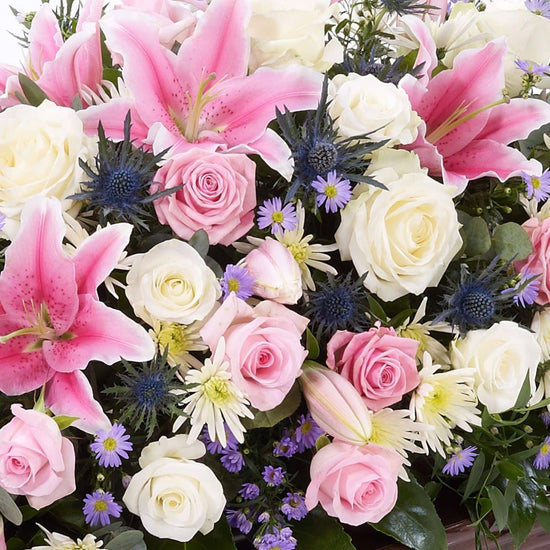 Rose And Eryngium Casket Spray 1