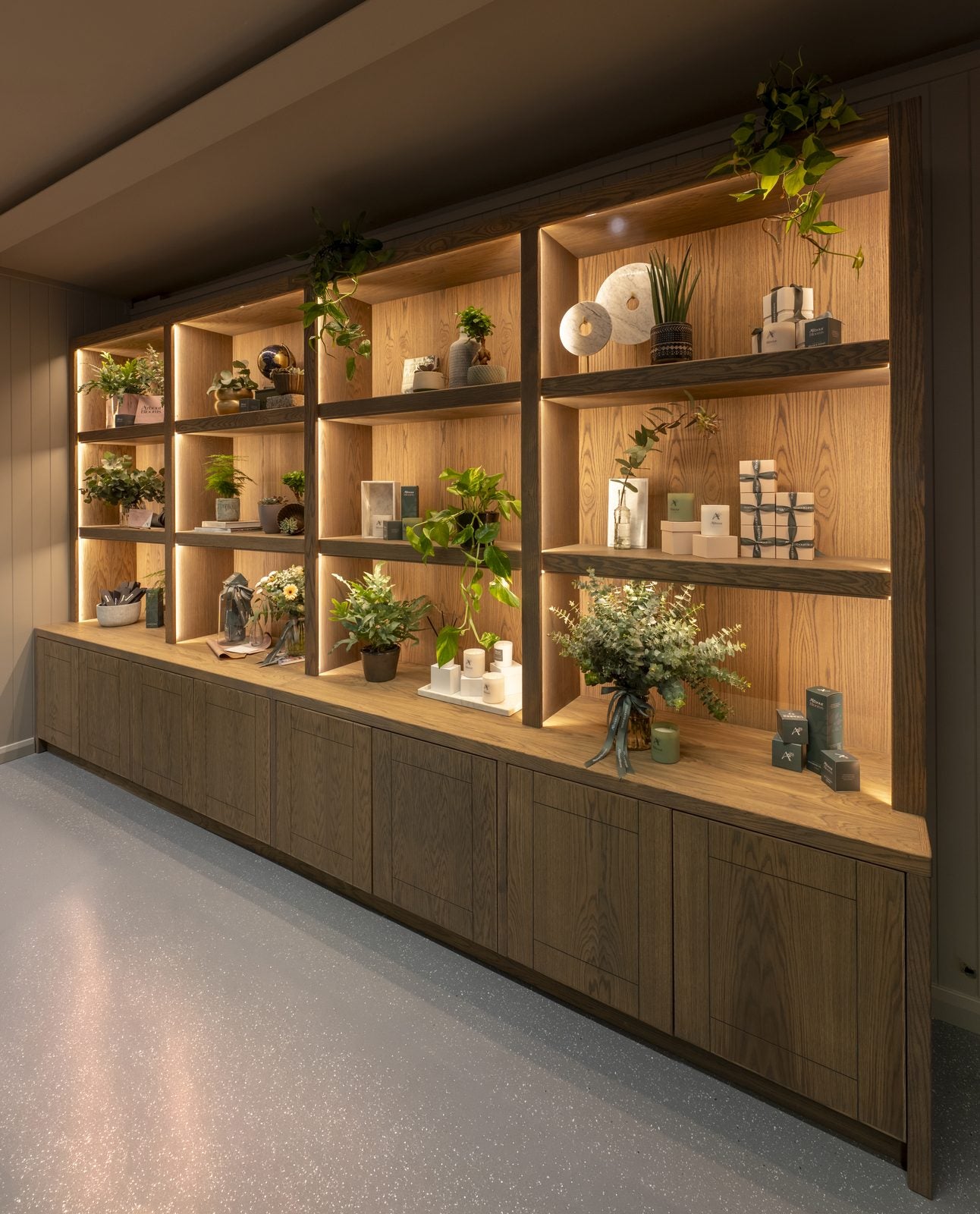 Backlit oak shelving styled with seasonal flowers and foliage at Arbour Blooms Flower Studio in Lusk, Co. Dublin